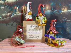 four xmas gnome figurines and gift box
