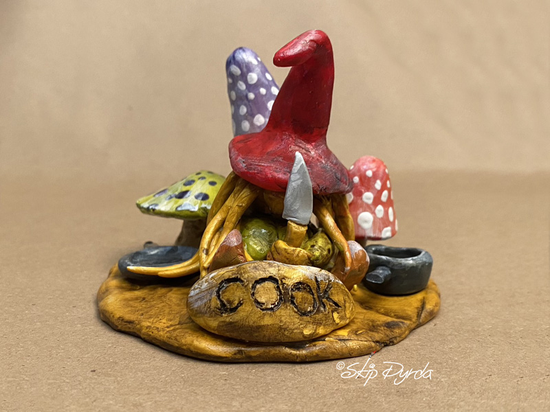 Painted clay gnome figurine as the cook