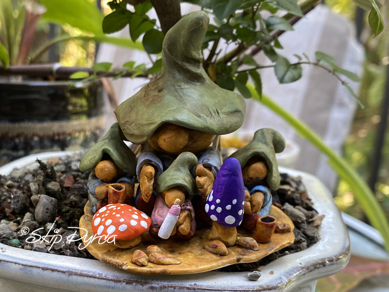 Painted clay gnome figurines as the mom and three kids