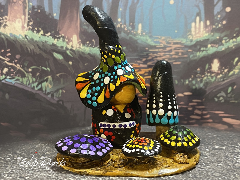 Painted clay gnome figurine with lots of polka dots