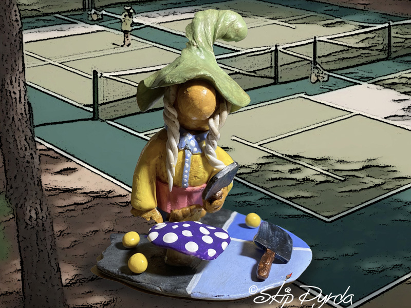 Painted clay gnome figurine as a pickle ball player
