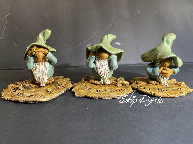 Painted clay gnome figurines as Say no Evil, Hear no evil and see no evil