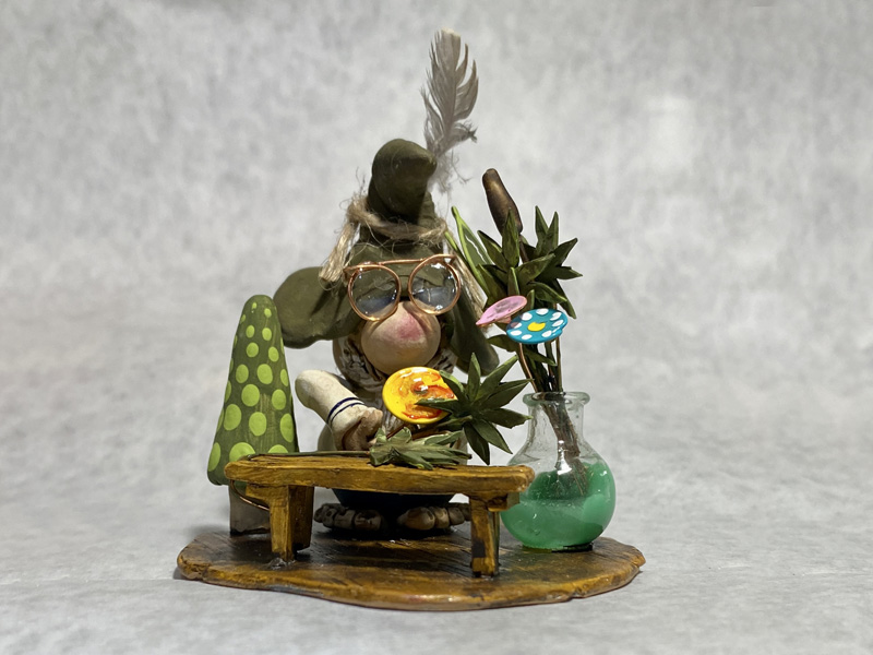 Painted clay gnome figurine as a doctor