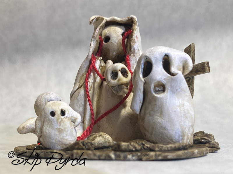 Painted clay gnome figurines dressed as ghosts